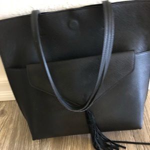 Women’s black tote bag with clutch